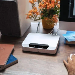 Bluesound POWERNODE EDGE — Wireless Hi-Res Streaming Amplifier -Trendy Electronic Audio Supplies Store DSC0783920POWERNODE20EDGE20on20desk20with20hand20 202048x2048 1050x1050 1